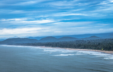 Obraz premium beach view from mountain top with hill range in background and amazing sky