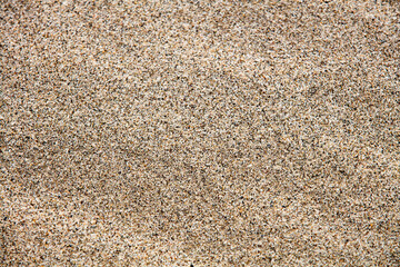 Close up sand texture on beach in summer. Sand background.