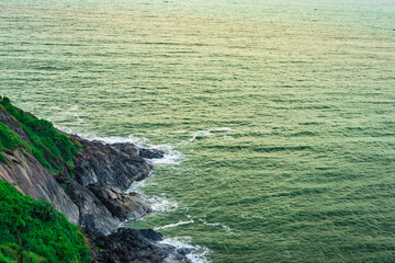 Fototapeta na wymiar mountain cliff view with sea shore at morning