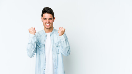 Young caucasian man isolated on white background showing fist to camera, aggressive facial expression.