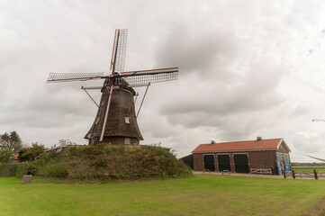 Fototapeta na wymiar A traditional dutch windmill in Linden, The Netherlands