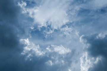 Dramatic dark blue sky with heavy clouds background
