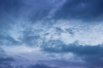 Dramatic dark blue sky with heavy clouds background