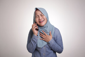 Muslim Woman Get Bad News when Talking on Phone, Sad Crying Expression