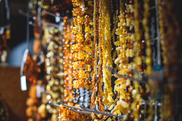 Variety assortment of souvenirs made of amber, traditional tourist souvenirs and gifts from Kaliningrad, Russia, in local vendor souvenir shop