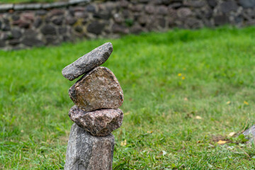 Stone stack on green grass
