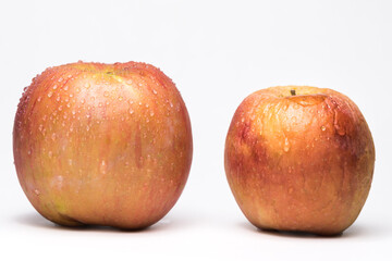 Variegated fresh and wrinkled apples a metaphor for aging. Concept of skin care and freshness