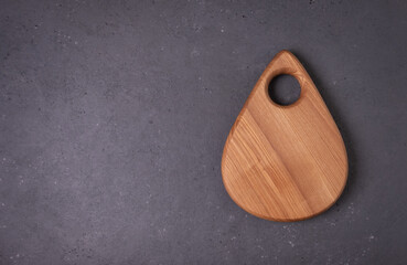 Food background. Cutting board on dark table. Copy space.