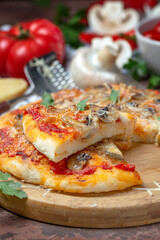 Pizza with vegetables, mushrooms and cheese.