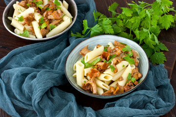 Pasta with mushrooms and  fresh green leaves