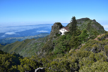 Fototapeta na wymiar Madeiran landscape with high mountains and Casa de Abrigo. Portugal.