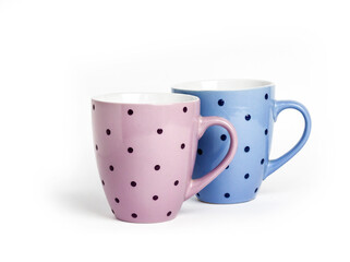 Two dotted tea cups isolated on white background