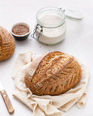 A loaf of freshly baked homemade sourdough flaxseed bread