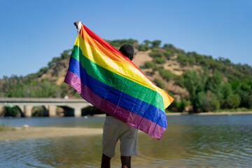 young african man wearing his gay flag