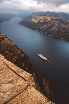 Top view of cruise ship cruising between the fjords in Norway