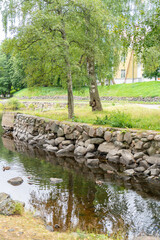 Duck walking on grass near river