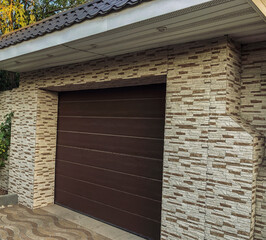 Modern, automatic  and convenient garage doors opening for a car.