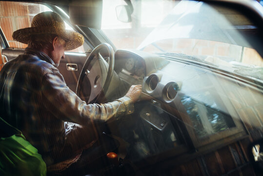 Old man pushing ignition start button