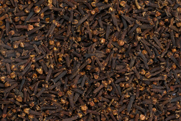 Dried cloves as background texture.