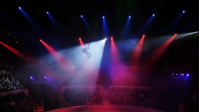 Aerialist on canvases in circus