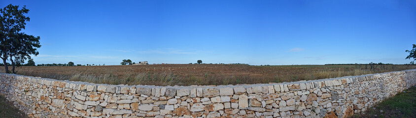 Close-up of stone wall laid dry, without cement.