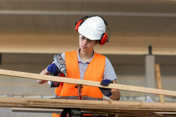 Young woman working in a workshop as artisan manual worker