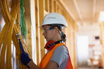 Young woman working in a workshop as artisan manual worker