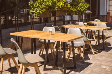 Outdoor cafe terrace with wooden furniture