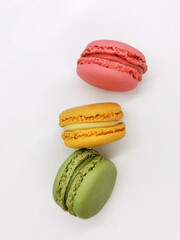 multicolored pastry macaron dessert isolated on white background