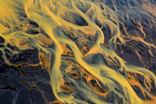 Colorful glacier rivers on the south coast of Iceland with black sand