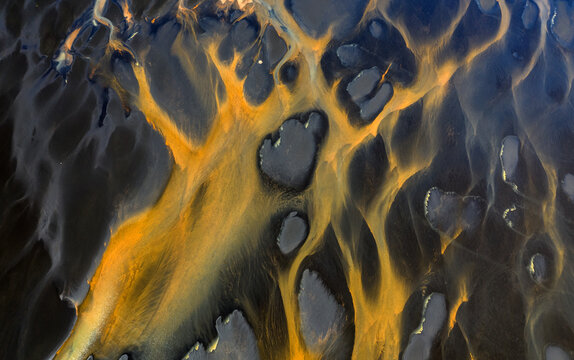 Colorful glacier rivers on the south coast of Iceland with black sand
