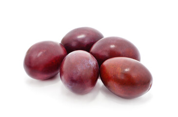 Blue plums with leaves.