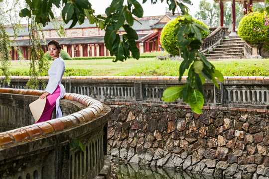 beautiful woman exploring the imperial palace in Hue / Vietnam