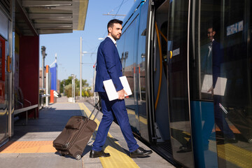 Young man waiting for the arrival of public transport