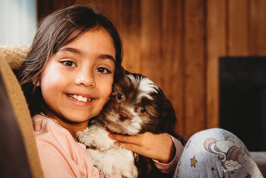 A little girl and her Shitzu puppy