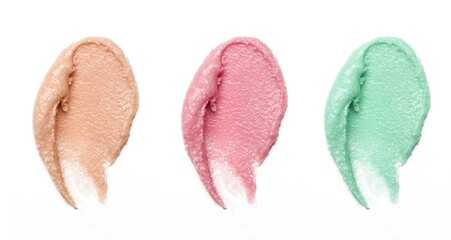 Cosmetics and makeup samples on white background