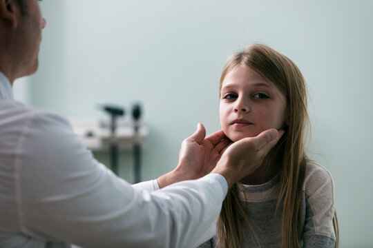 Exam: Doctor Checks Glands Of Young Patient