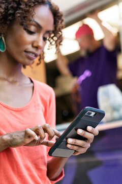 Food Truck: Woman Using Mobile Ordering On Phone