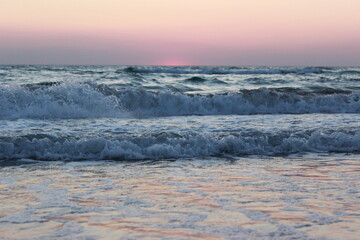 Mesmerizing sea surf at sunset. Olenevka