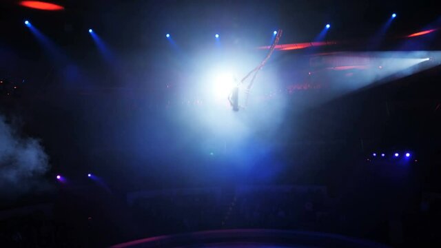 Aerialist on canvases in circus