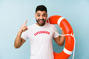 Young latin lifeguard man isolated having an idea, inspiration concept.