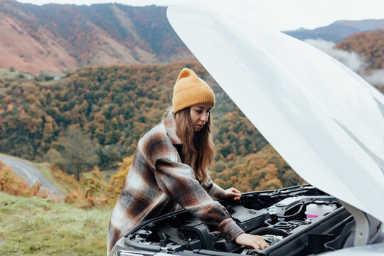 woman rearing her broken car