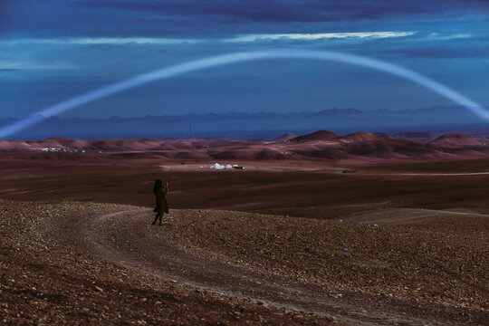 Anonymous Woman in Utopian Desert at Dawn