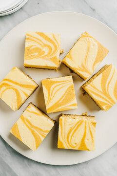 Overhead Plate Of Pumpkin Cheesecake Bars