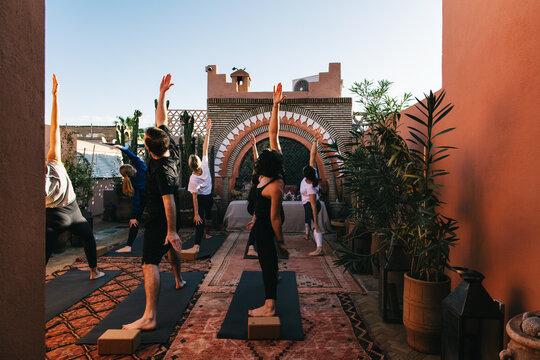Hatha Yoga Group Practice on Sunny Rooftop