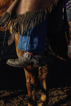boot spur and chaps of rider horseback