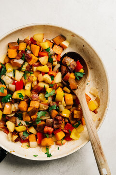 Apple and sweet potato hash in a skillet