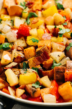 Closeup of apple and sweet potato hash in a skillet