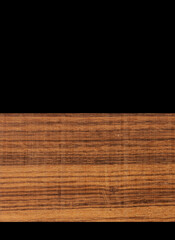 Close up of natural wood on black background