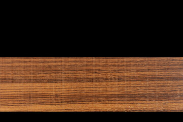 Close up of natural wood on black background
